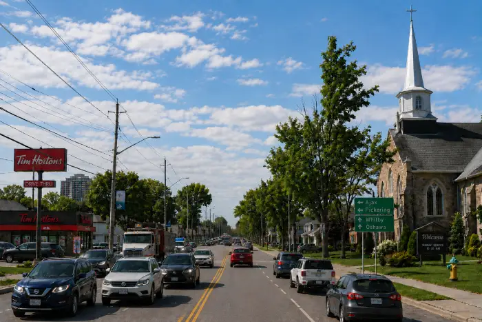 Kingston Road in Durham Region Ontario with local businesses, Tim Hortons, and a Christian church
